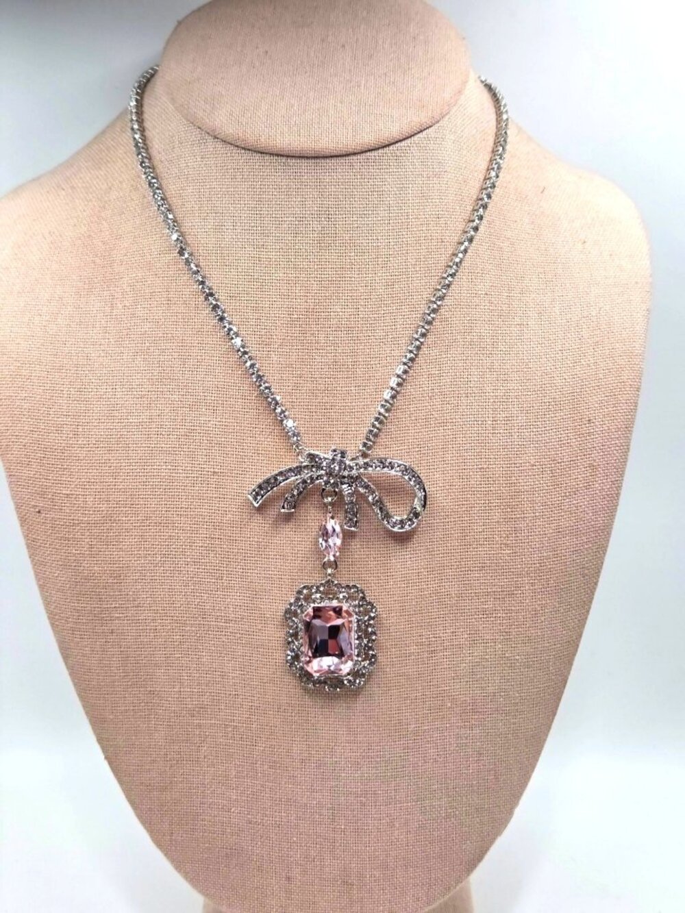 Silver-Tone Bow Pendant Necklace With Pink Rhinestones & Crystal Accents